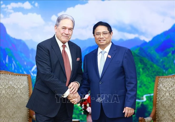越南政府总理范明政与新西兰副总理兼外交部长温斯顿·彼得斯。图自越通社