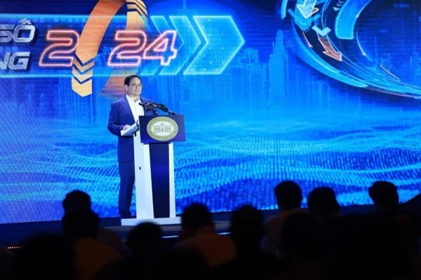 Премьер-министр Фам Минь Тьинь выступает на мероприятии. (Фото: ВИA)
