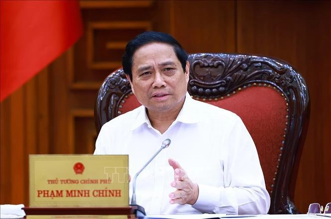 Le Premier ministre Pham Minh Chinh lors de la réunion, à Hanoi, le 17 mai. Photo: VNA