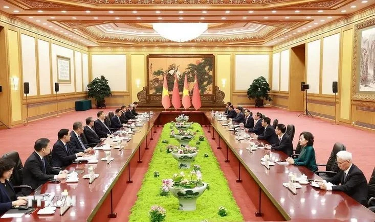 Entrevue entre le Premier ministre Pham Minh Chinh et le secrétaire général du Parti communiste chinois et président chinois Xi Jinping. Photo: VNA