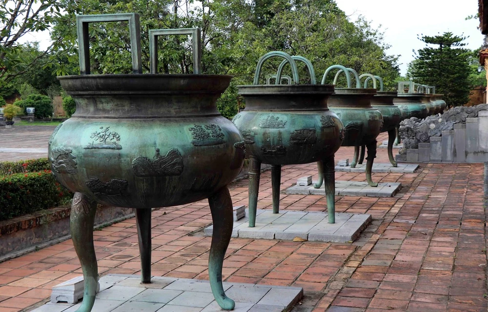 Photo: Cuu dinh” (Nine Dynastic Urns) are placed in front of the Hien Lam Pavilion inside The To Temple in the Hue Imperial Citadel (Dai Noi) for over 200 years. (Photo: VNA)