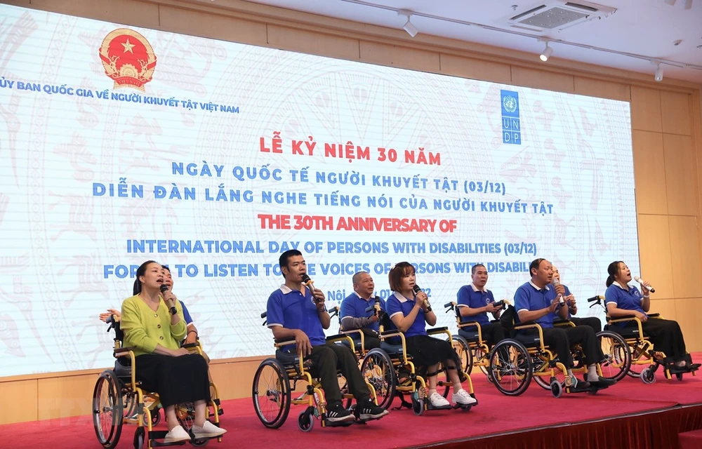 At the ceremony to mark the 30th anniversary of International Day of Persons with Disabilities (Photo: VNA)