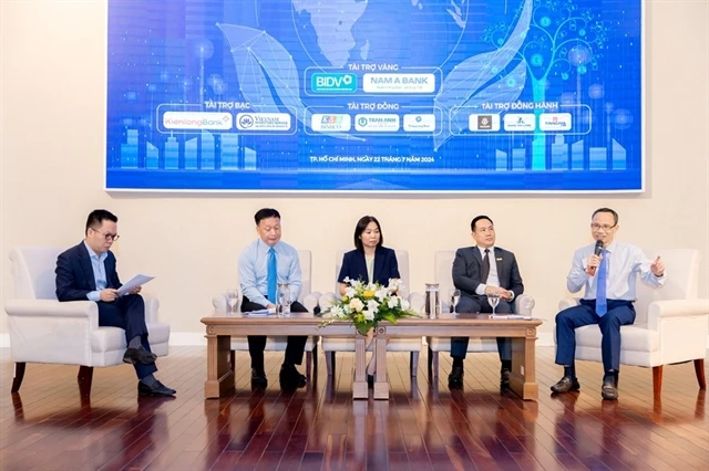 Panellists at the 2024 Green Finance Forum held in HCM City on July 22 discuss opportunities for developing financial products in Vietnam. (Photo: thoibaotaichinhvietnam.vn)