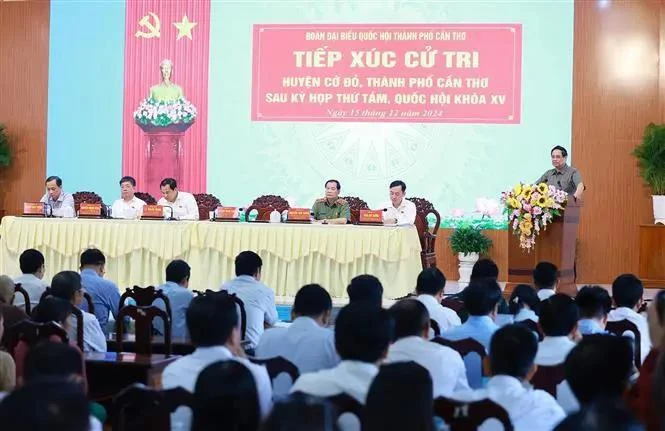 Prime Minister Pham Minh Chinh addresses a meeting with voters in Can Tho's Co Do district on December 15 (Photo: VNA)