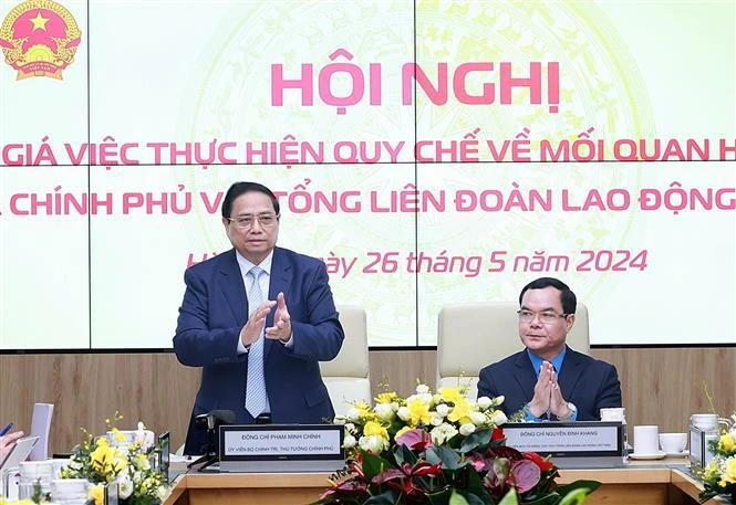 越南政府总理范明政出席会议。图自越通社